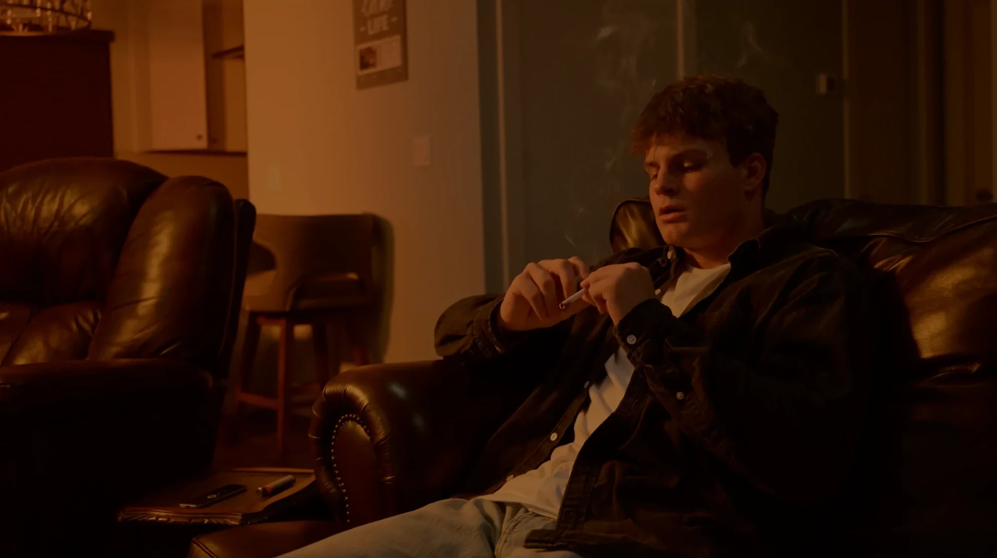 Malachi alone in the living room — still from ‘Ven