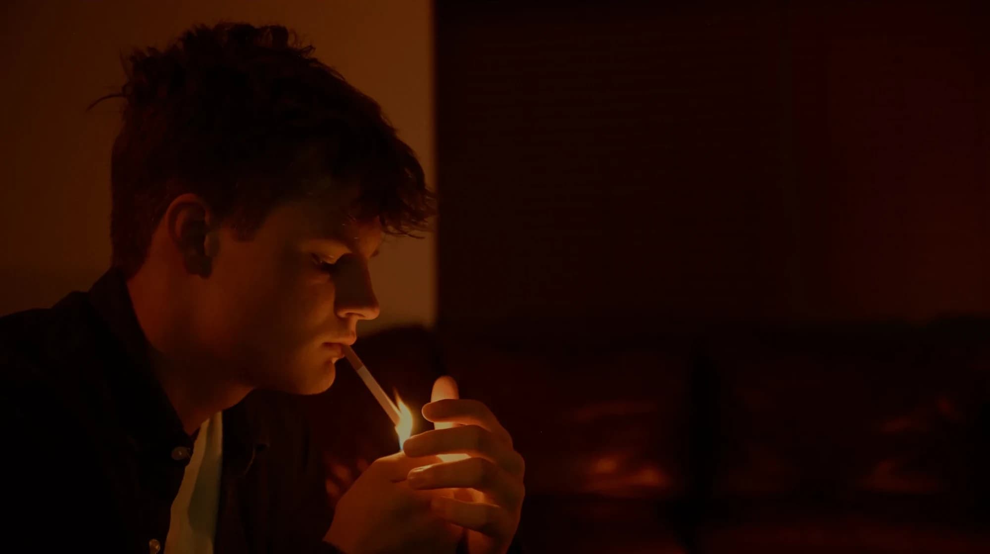 Malachi lighting Pyre in the dark — still from ‘Ven