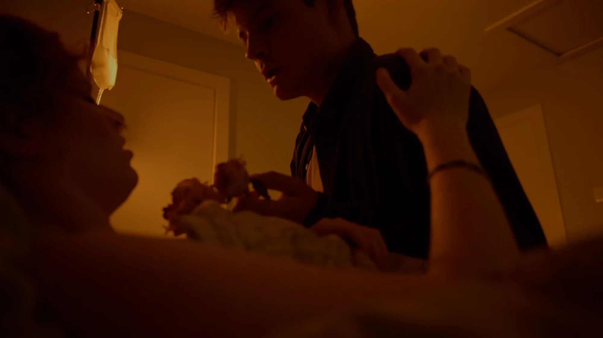 At the hospital bedside — still from ‘Ven